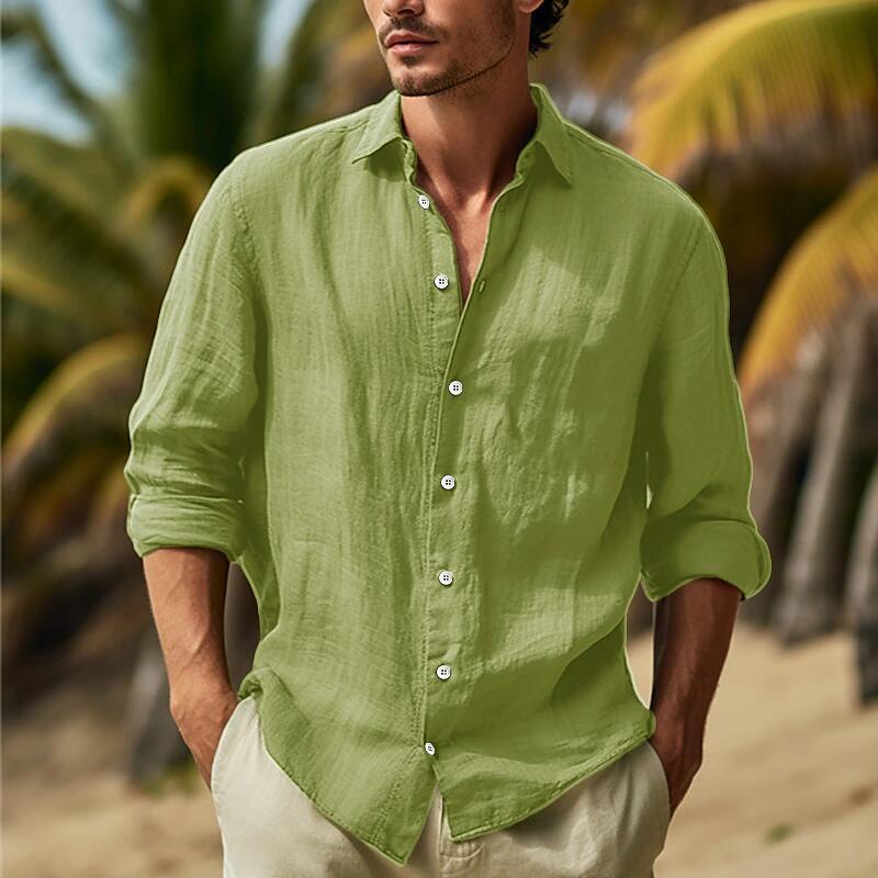 A light green men’s relaxed fit long sleeve shirt made of cotton linen with a button-up front and rolled cuffs.