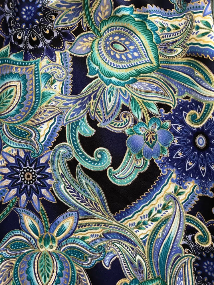Vintage paisley deco floral midi dress with pockets featuring vibrant blue and teal paisley fabric on navy background