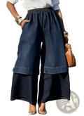 Dark blue denim deconstructed wide leg pants with elastic waistband and layered two-piece design
