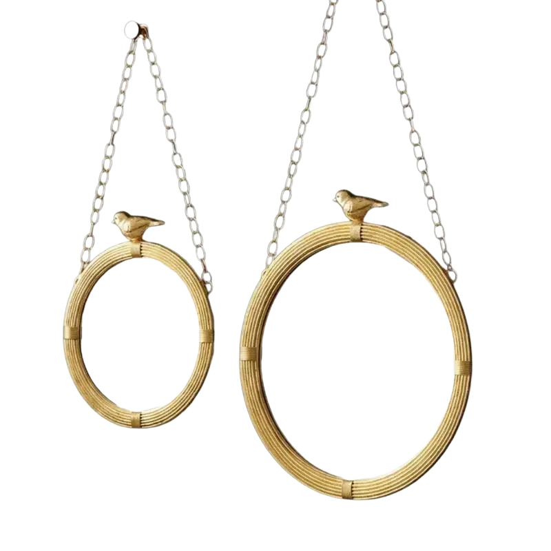 Decorative mirrour with gold-toned oval resin frame and woven rattan for stylish interior wall decor with bird figurines