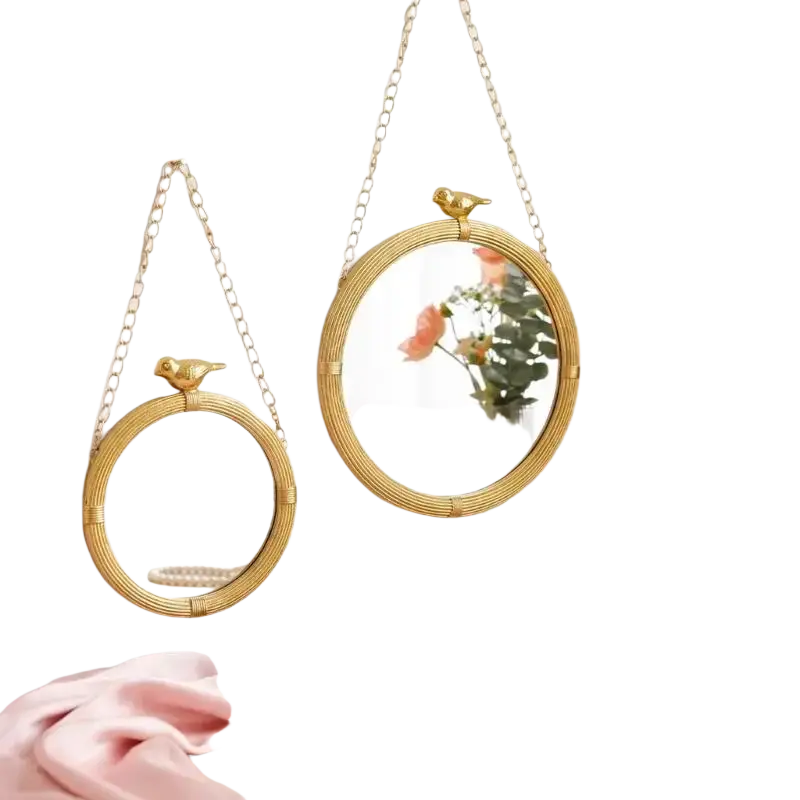 Two gold-toned decorative mirrour with resin frame and woven rattan design for interior wall featuring bird finials