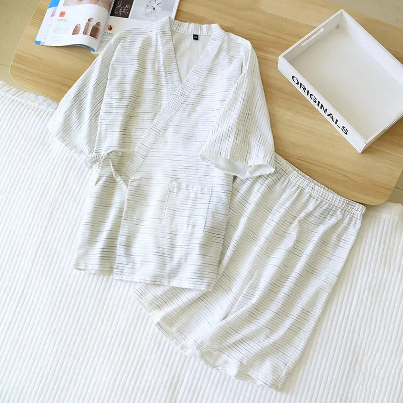White kimono style cotton pajama set for men featuring subtle gray vertical stripes and soft lightweight fabric.