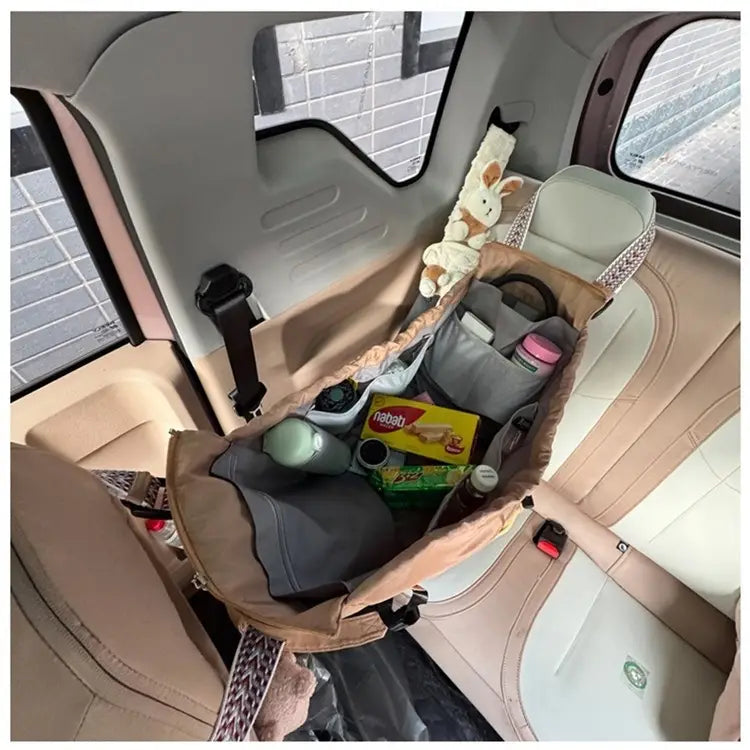 Beige and gray multifunctional waterproof nylon car seat organizer with multiple compartments mesh pockets and fabric straps suitable for tote and backpack use.