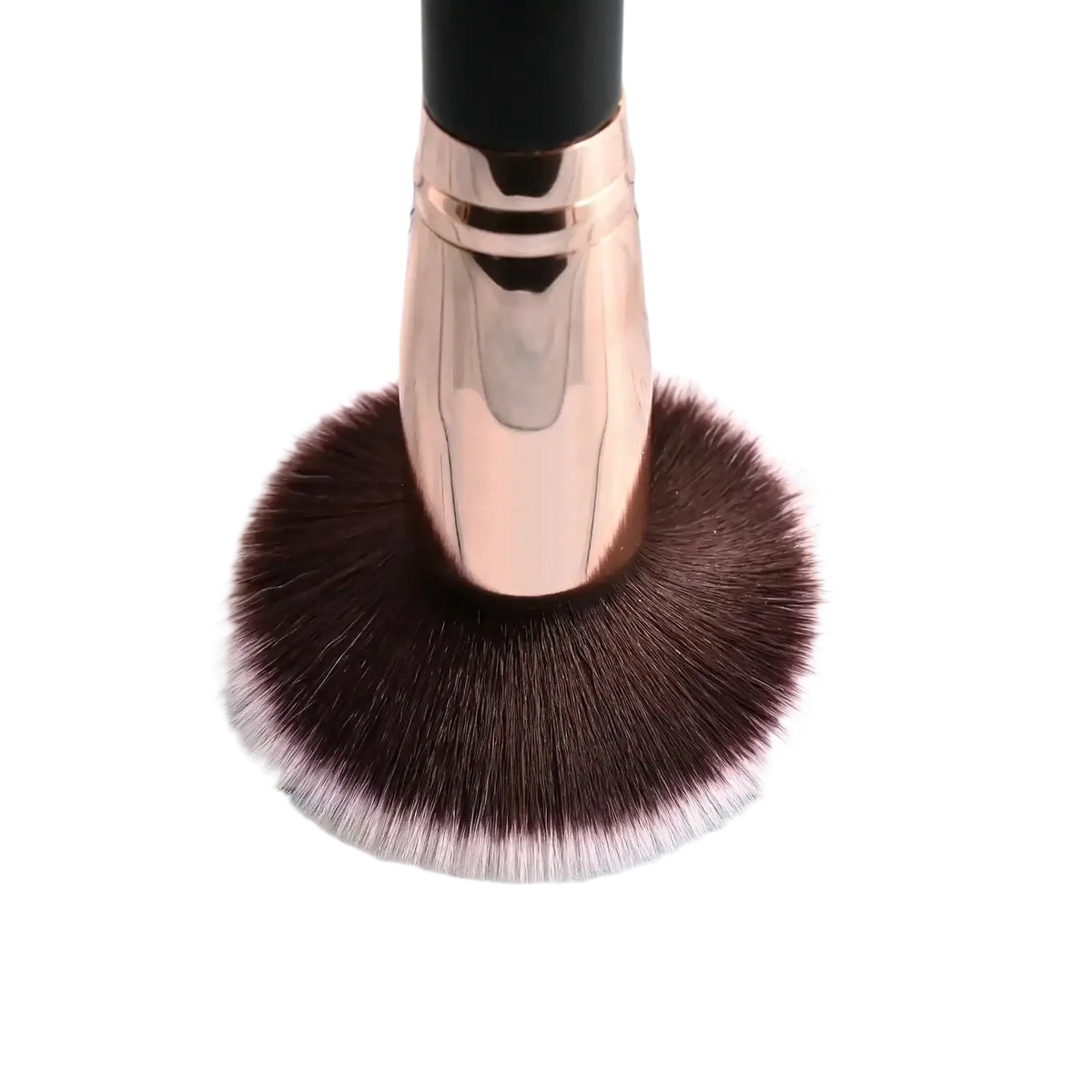 Rose gold finished makeup brush with dense dark brown bristles tipped in soft pink shown with deep blue essential oil blend 120 ml tube
