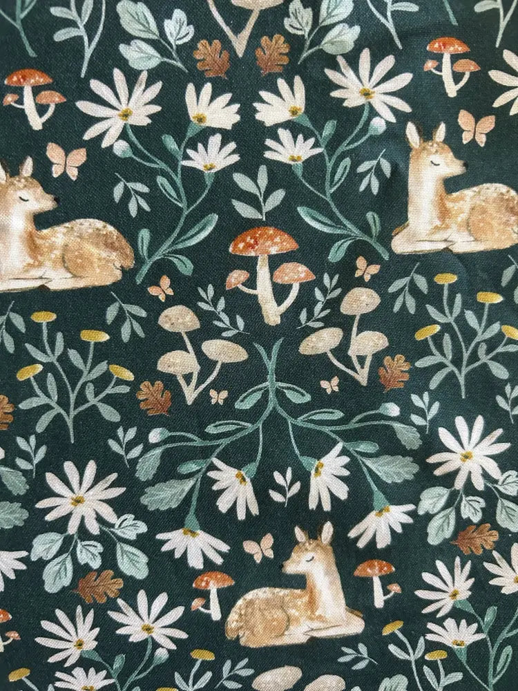 Dark green vintage floral deer print cotton midi dress with pockets featuring cream fawns daisies mushrooms and butterflies