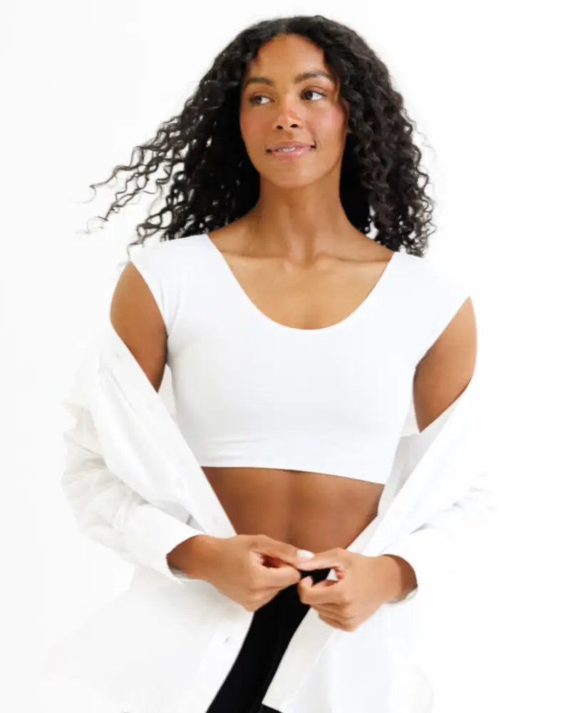 White demi tri blend fitted crop tee with scoop neckline and cut-out shoulders showing front view