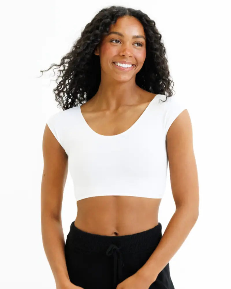 White fitted crop tee with scoop neck and short sleeves made from demi tri blend fabric