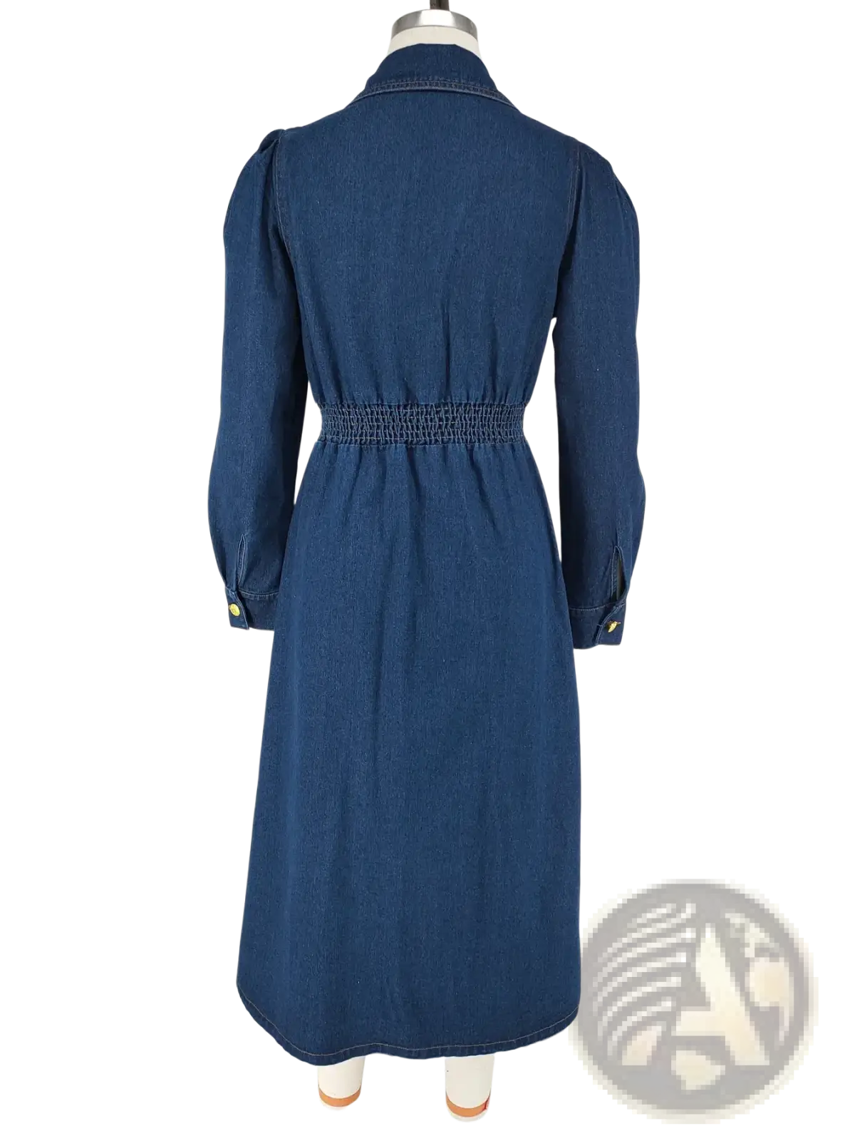 A navy blue denim dress with a fitted waist long sleeves and buttoned cuffs perfect for casual wear
