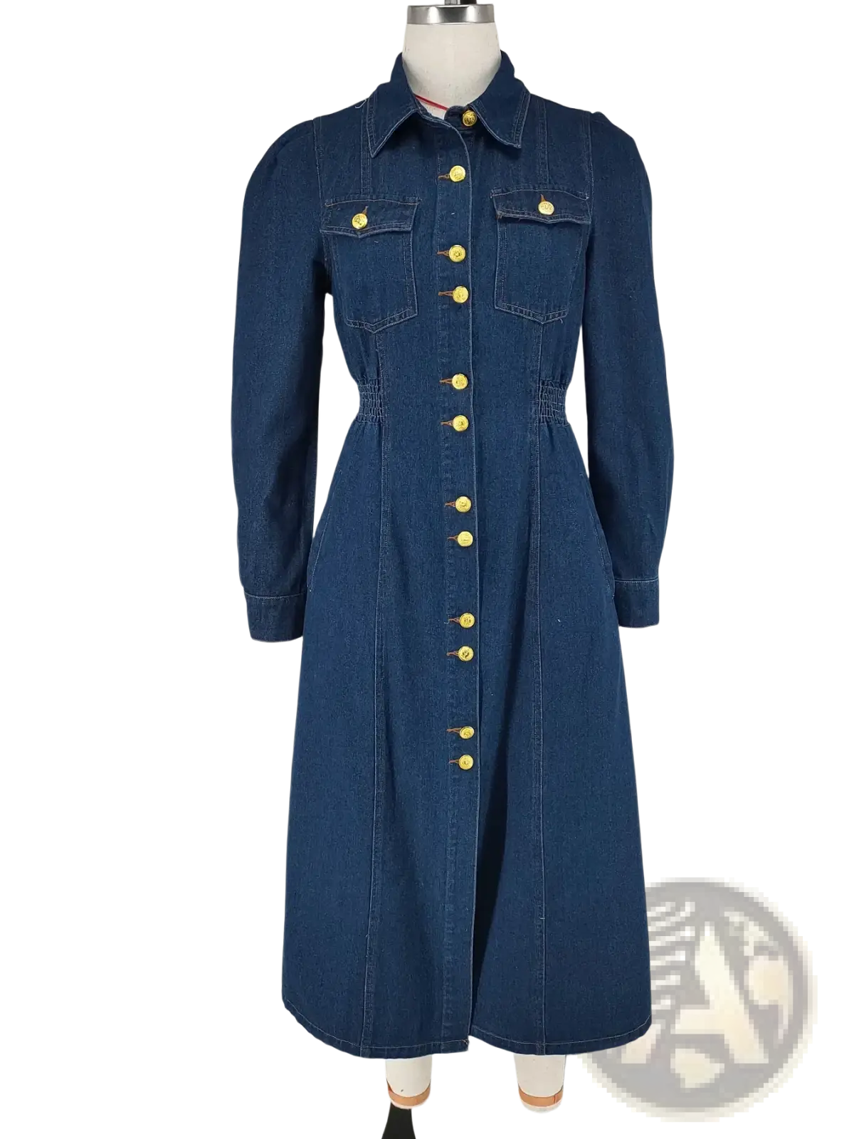 A navy blue denim dress with long sleeves gold-tone buttons collar and two front pockets for casual wear