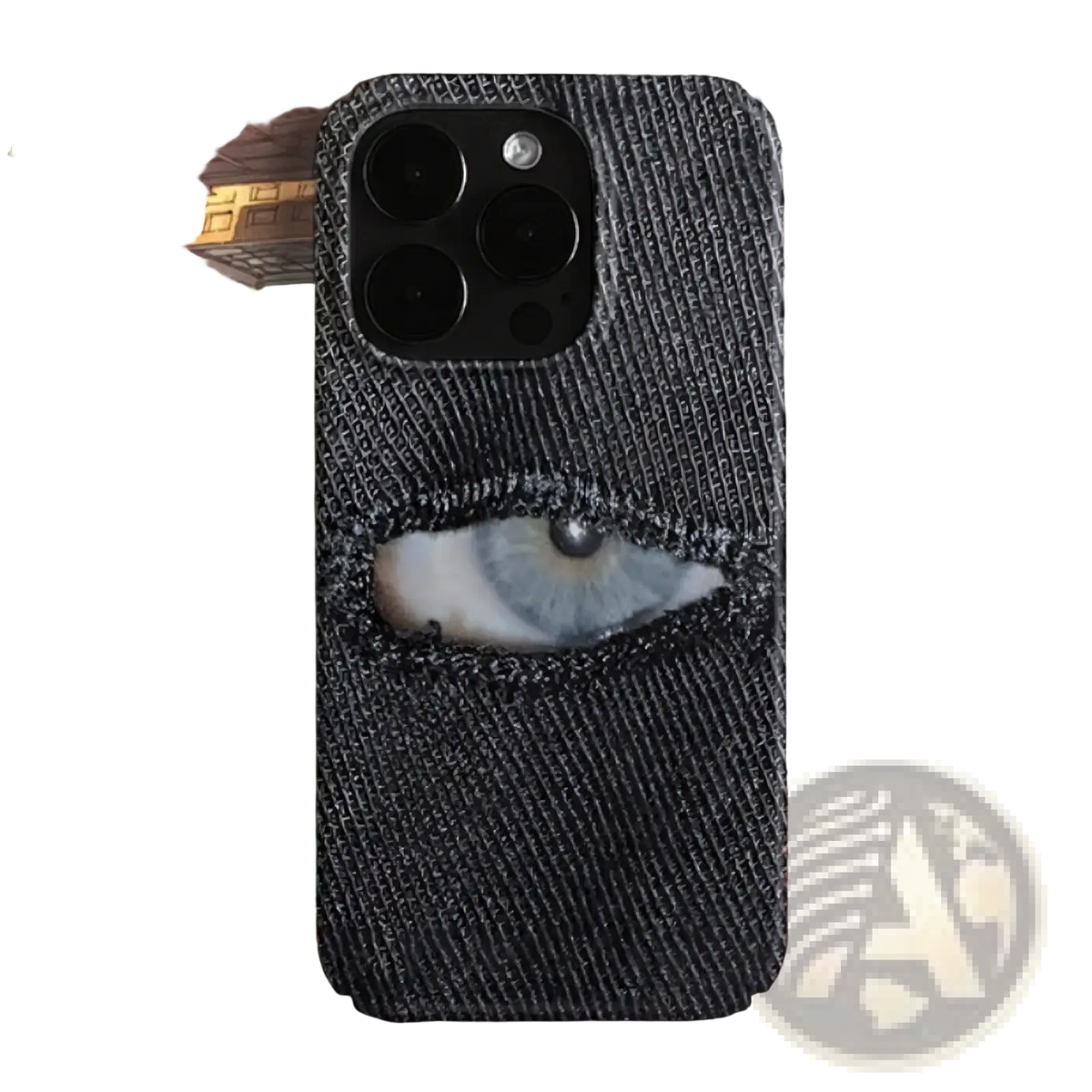 Dark denim-textured back phone case featuring a realistic eye peeking through a torn hole in denim blue design