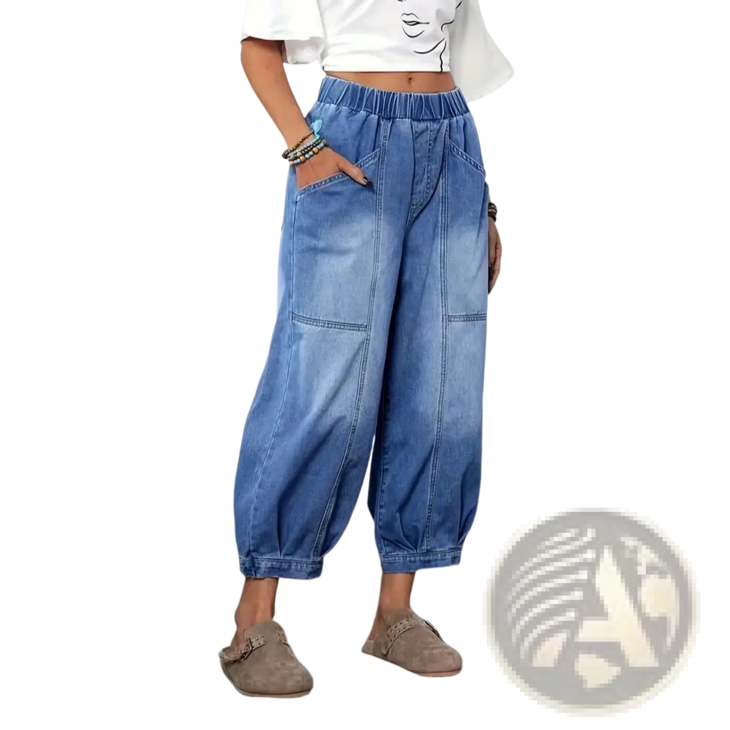 Light-wash denim capri pants with wide legs elastic waistband and two large patch pockets in a retro high waisted style