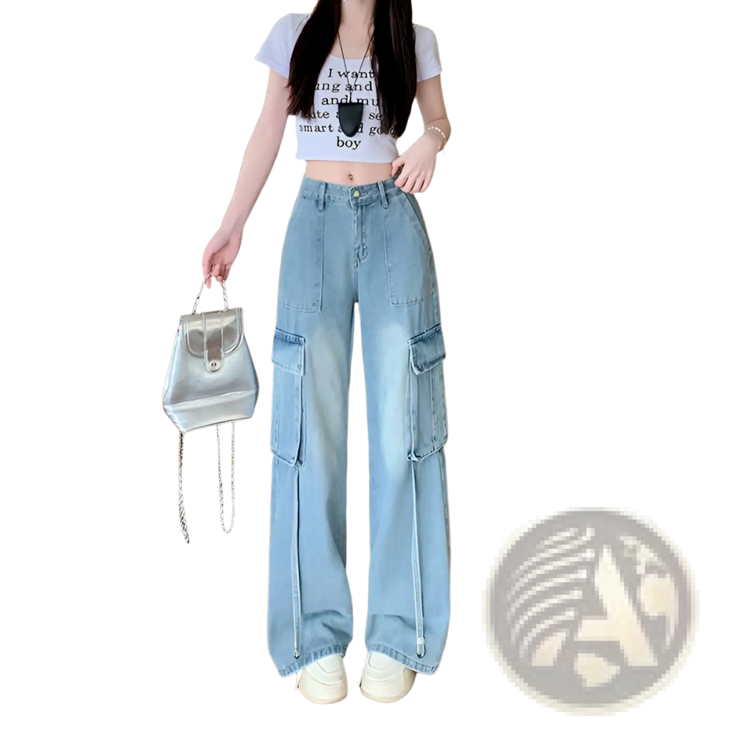 Silver metallic mini backpack with chain strap paired with denim cargo pants wide leg light wash front view