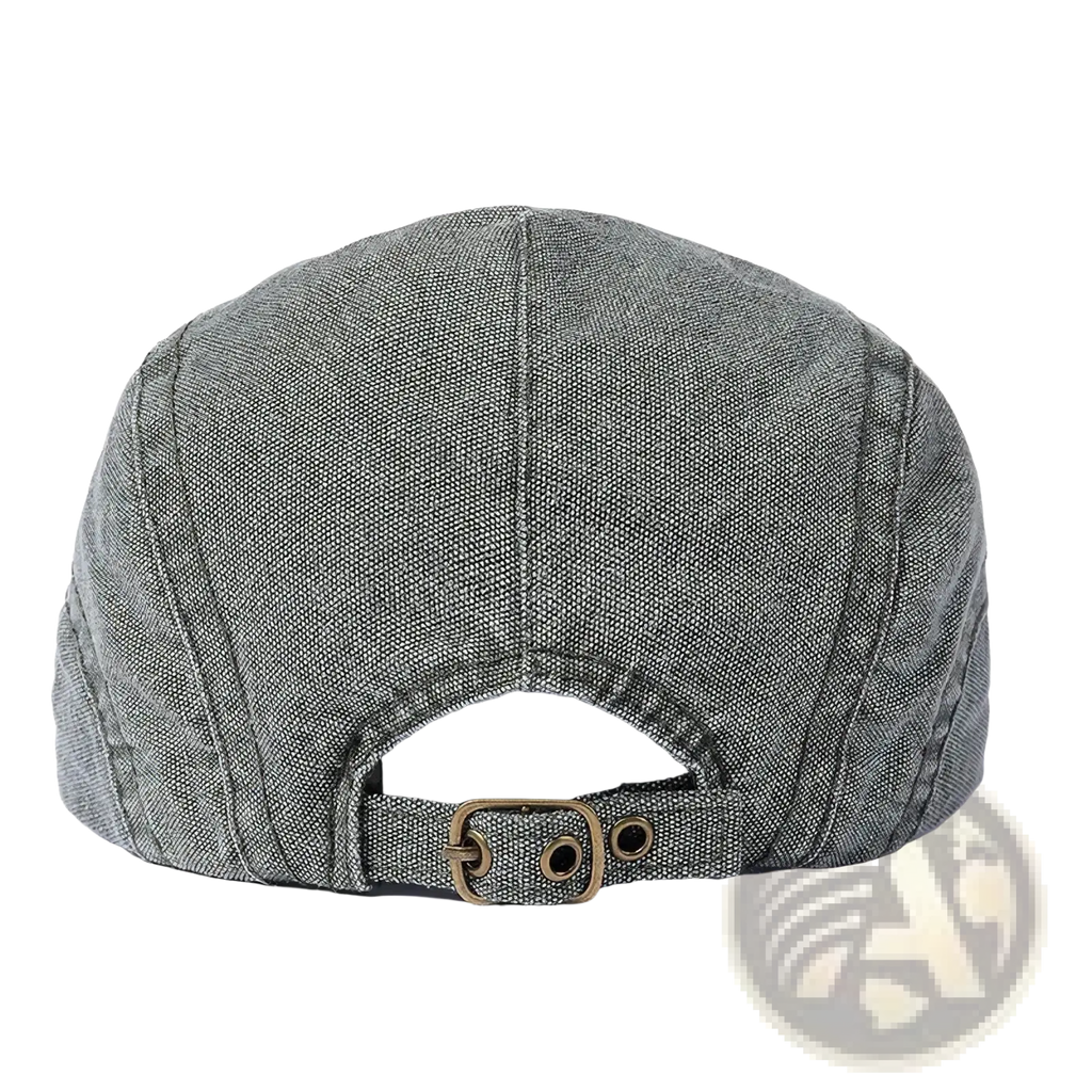 Gray denim flat cap with brass buckle and adjustable strap showing the back side of this vintage beret hat