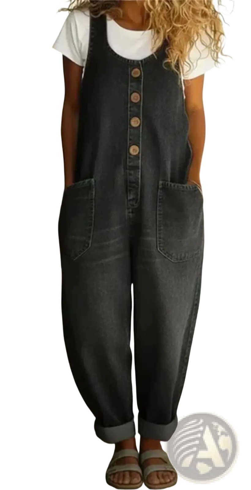 Dark-wash denim jumpsuit sleeveless pocket overalls with wooden buttons worn by a person standing outdoors