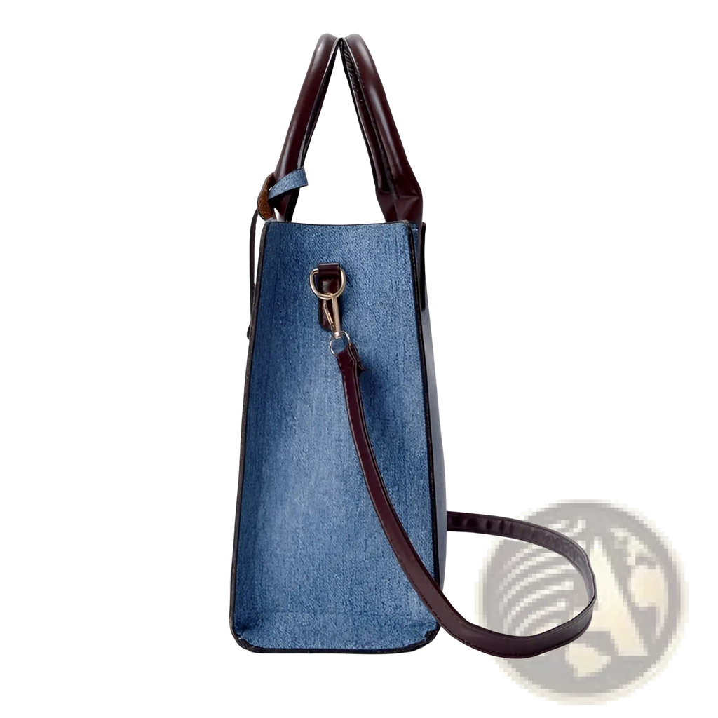 Denim and leather three piece handbag set featuring a denim blue bag with brown leather handles and strap