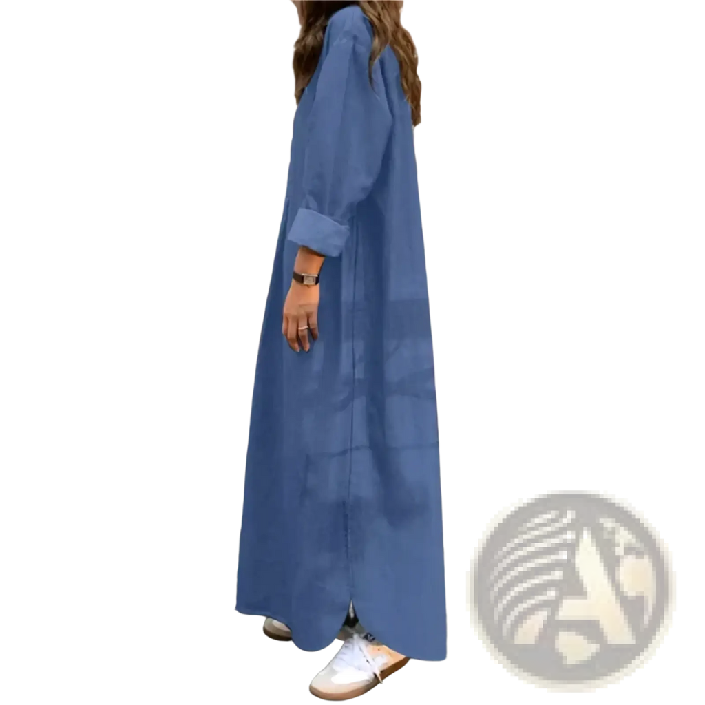 A long flowing blue cotton denim maxi dress with oversized relaxed fit and rolled-up sleeves for casual wear