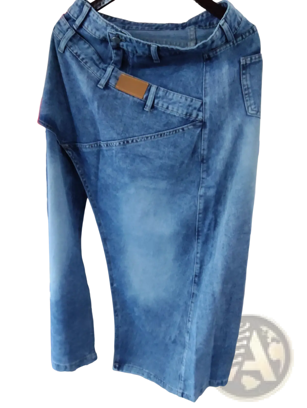 A mid-blue denim maxi skirt with high waist asymmetrical slit and five-pocket design shown from the back side