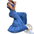 Blue denim ruffled flare jumpsuit featuring flowing maxi design with tiered hem and ruffled sleeves