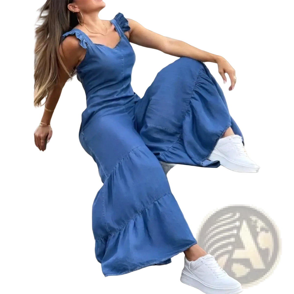A flowing blue denim maxi dress with ruffled shoulder straps and a tiered hem in a denim ruffled flare jumpsuit style