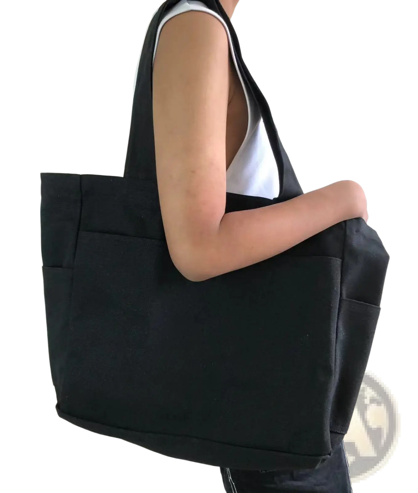 Black canvas denim tote bag with large capacity, two front pockets, and sturdy handles for shoulder use