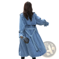 Light blue denim trench coat for women with frayed cuffs and belted waist perfect for autumn maxi wear