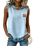 Light blue and white wavy striped sleeveless hoodie with denim shoulder panels and brown leather chest patch