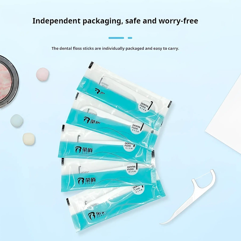 Dental floss picks 100 count individual packets showing six teal and white plastic floss sticks and one floss pick