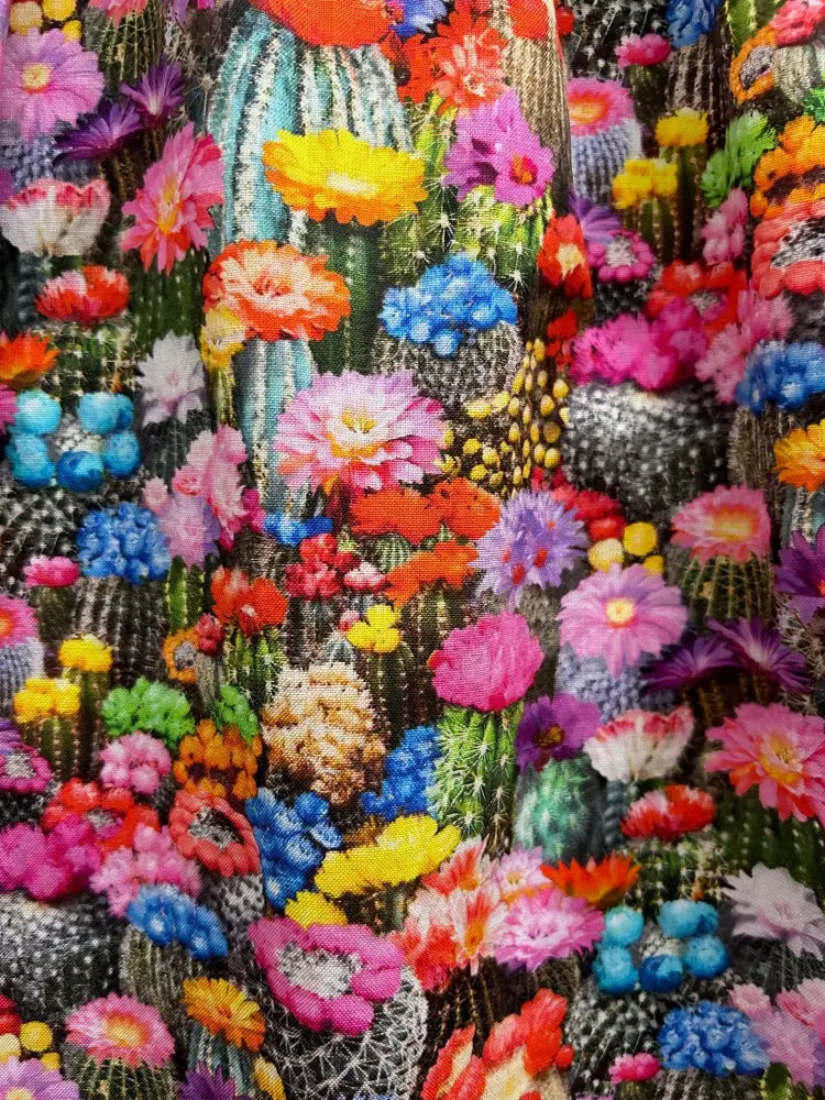 Desert Blooms sleeveless cotton fit and flare mini dress with vibrant multicolored cactus and flower print fabric