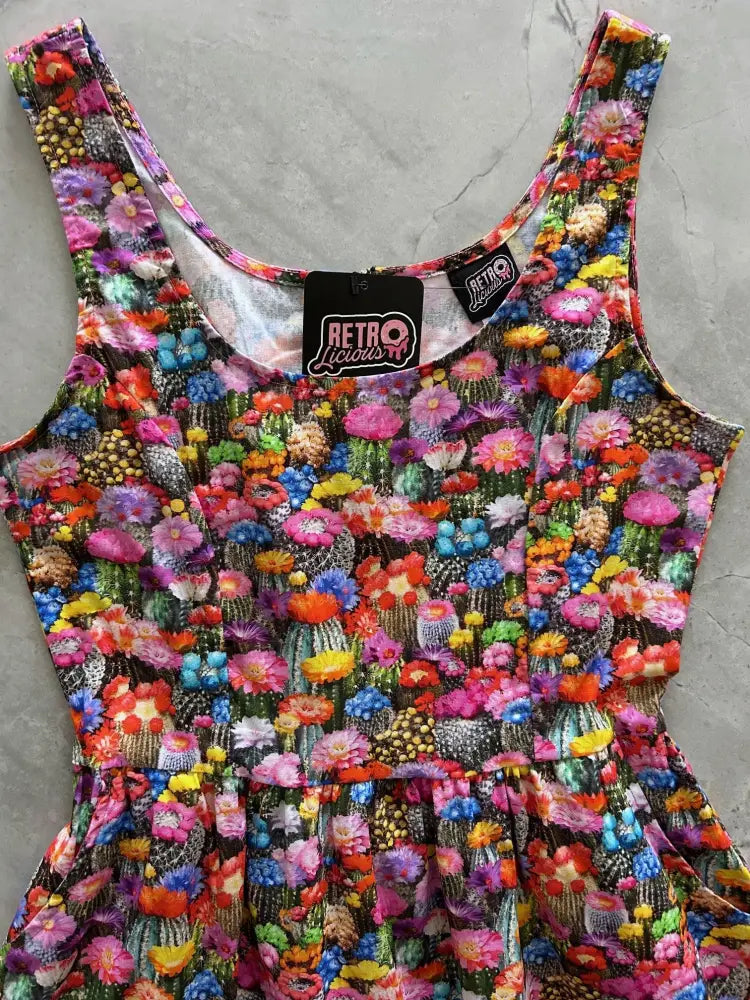 A vibrant desert blooms sleeveless cotton fit and flare mini dress by Retro Liquor with colorful cactus and flower print