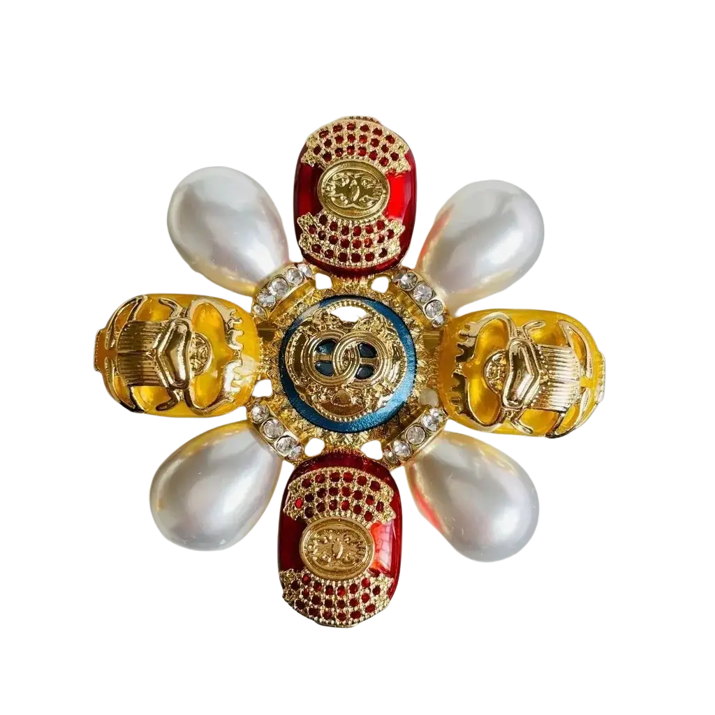 Designer pearl brooch beetle rhinestone pin featuring gold-toned scarab beetles red enamel and a central blue medallion