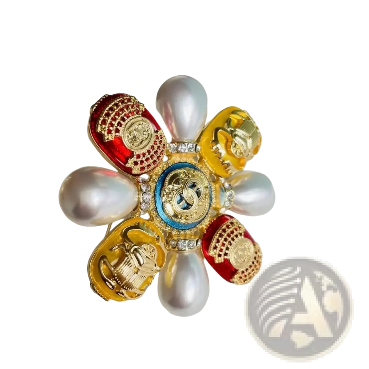 A vibrant flower-shaped Chanel brooch with red and gold enamel petals, pearls, crystals, and a central blue medallion