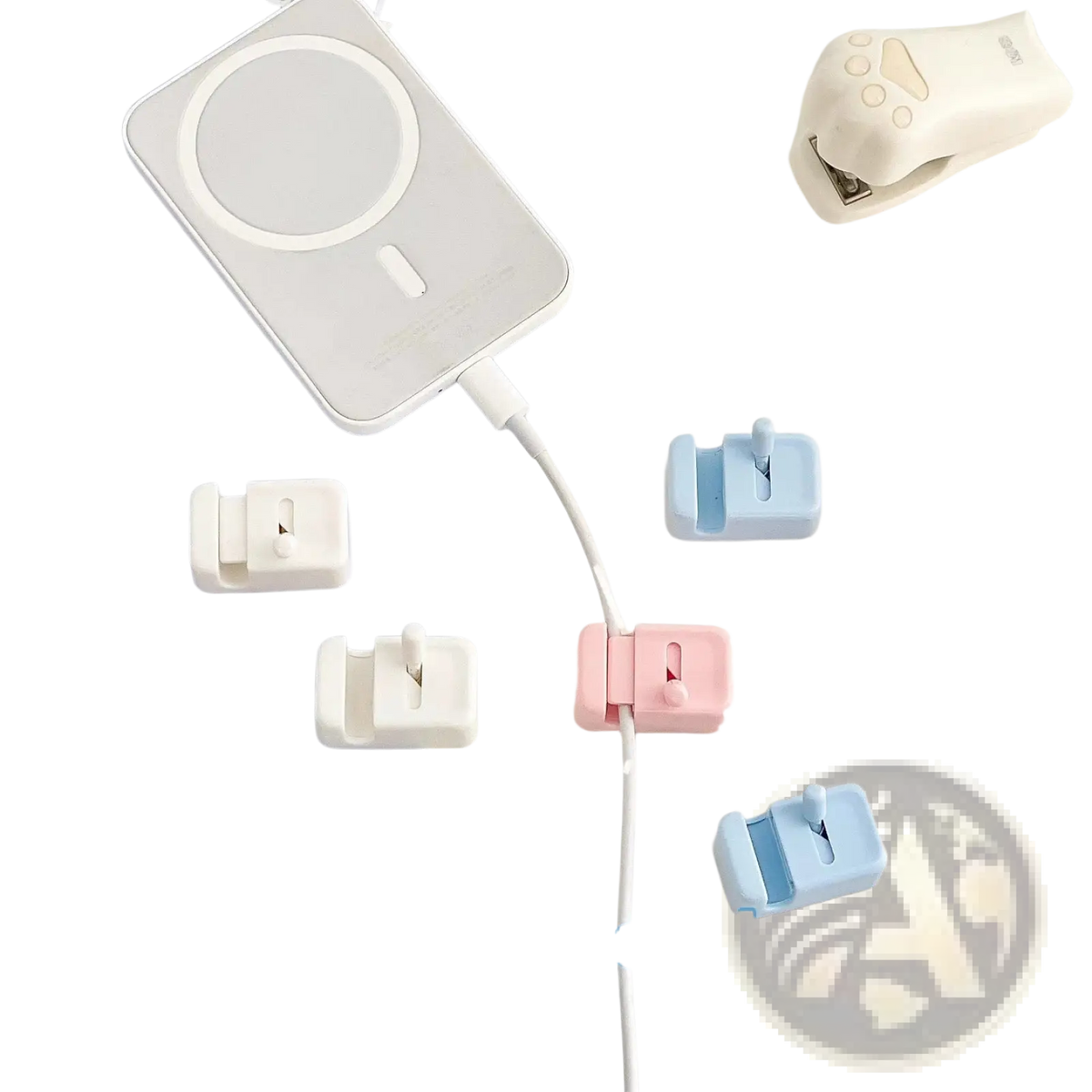Pastel pink and light blue plastic desk cable clips no drill cord organizers with a minimalist design for cable management