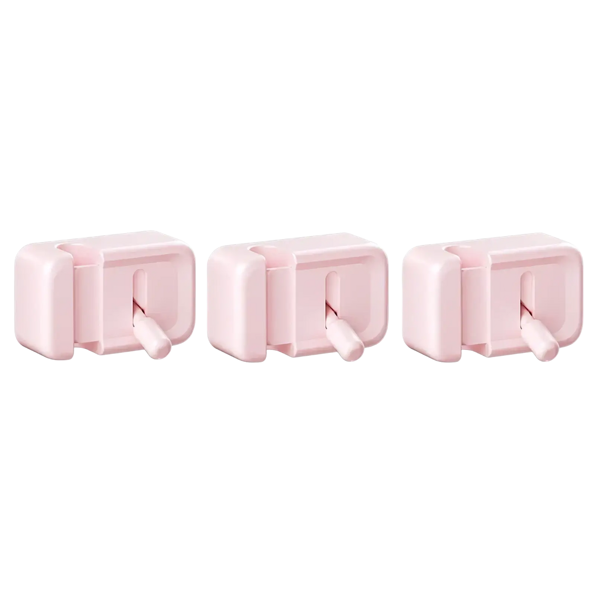 Three pale pink plastic desk cable management clips with no-drill wall-mounted rectangular hooks and small tabs