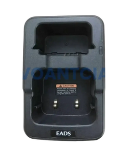 Black plastic desktop charger for th1n th9 thr8 radios with molded compartments and metallic contacts for secure charging