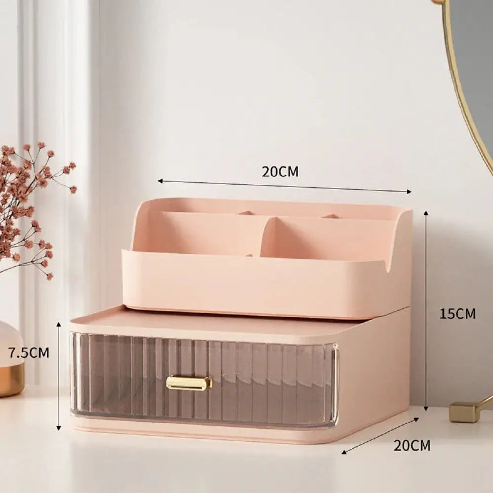 Modern two tiered desktop makeup and jewelry organizer in pink with a translucent drawer and gold tone handle