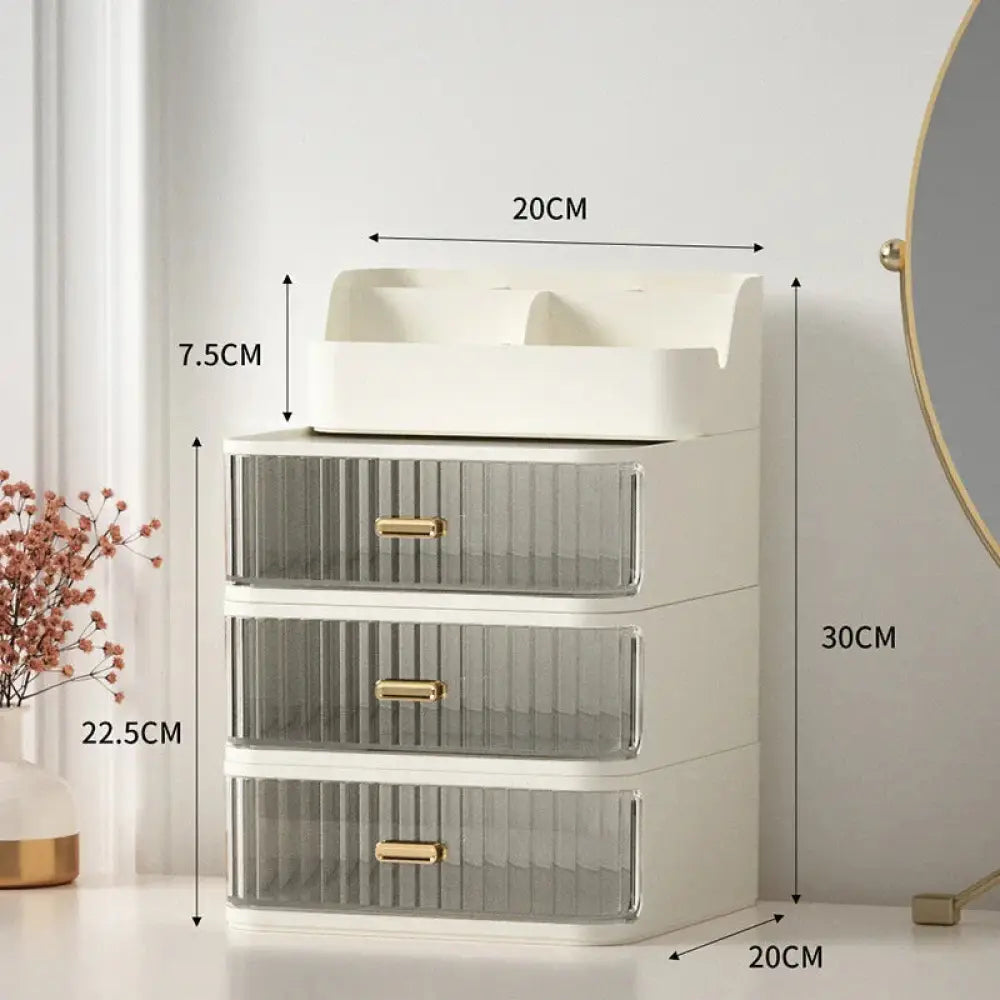 White and translucent plastic three-drawer organizer with gold-tone handles for modern desktop makeup and jewelry storage