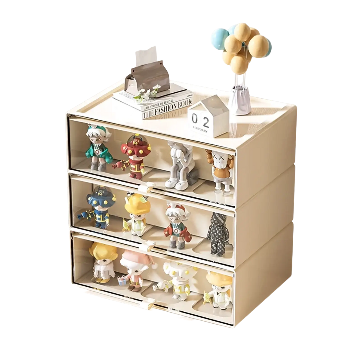 Beige three-drawer desktop organizer with clear fronts and white handles displaying colorful collectible figurines