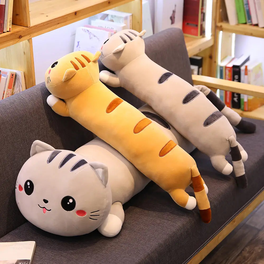 Three plush cat-shaped body pillows in yellow with orange stripes and gray with black stripes soft stuffed animal toy for cuddling and decoration.
