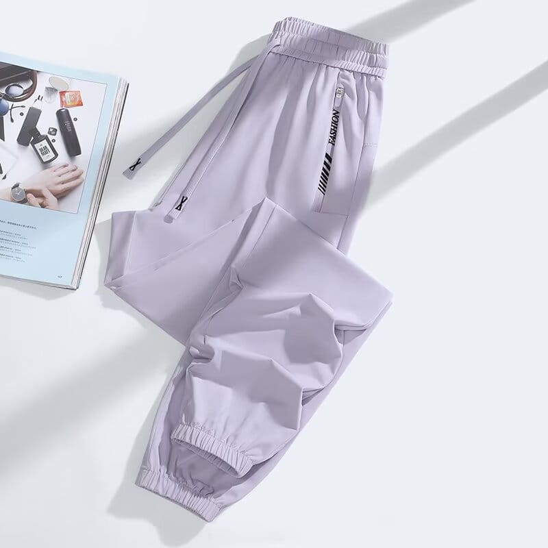 Light purple anti mosquito casual athletic trousers with elastic waistband drawstring and a side pocket branded fashion in black text.