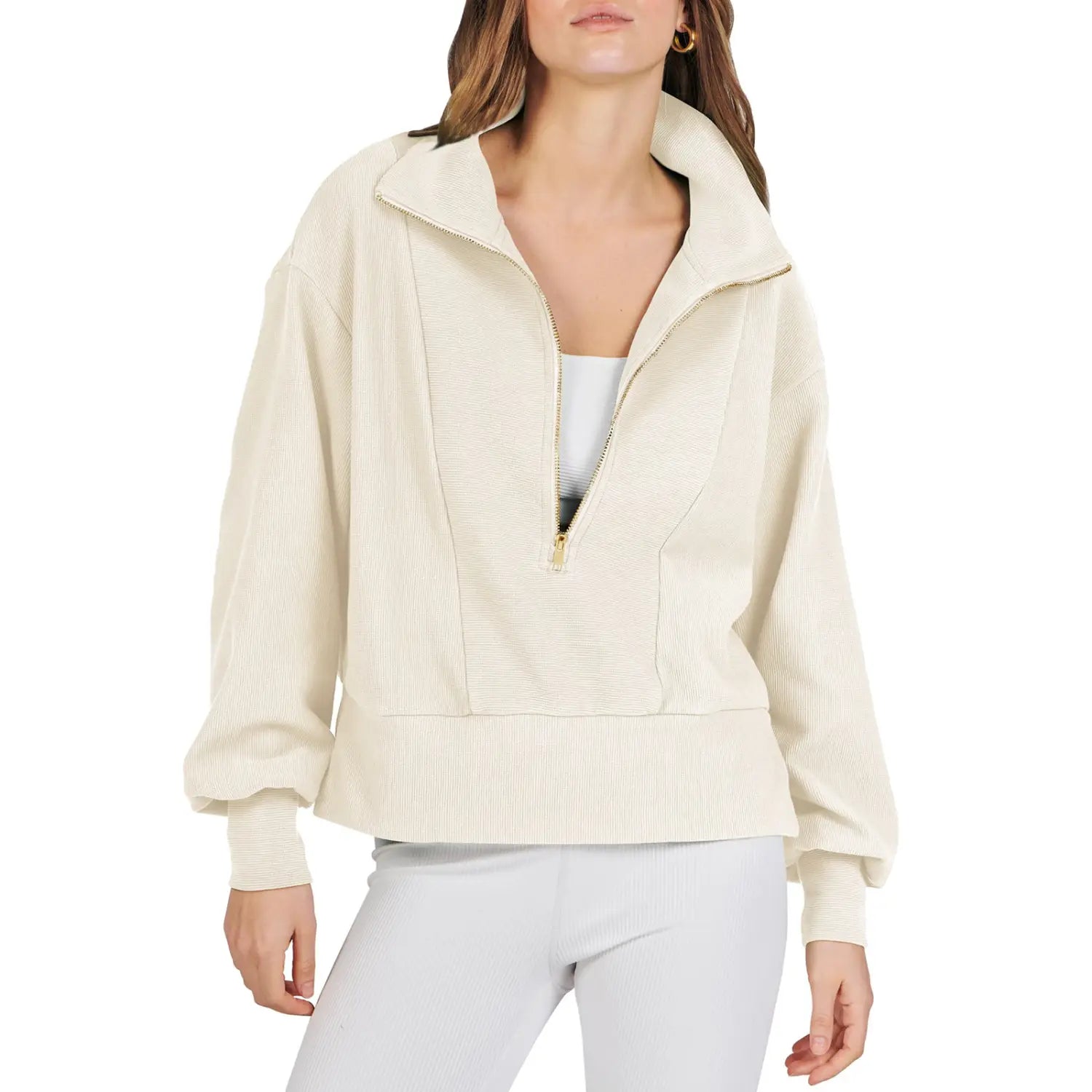 Cream-colored ribbed knit half-zip pullover sweatshirt with a high collar and gold-toned zipper detailing.