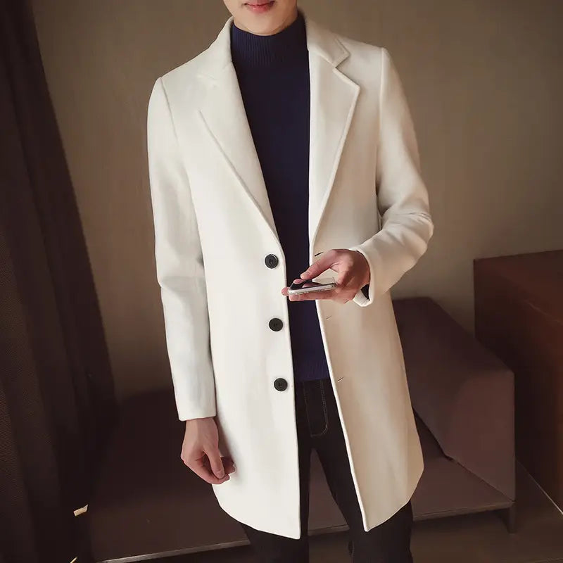 A sleek white wool slim trench coat for men featuring black buttons and a classic notched lapel in Korean style.