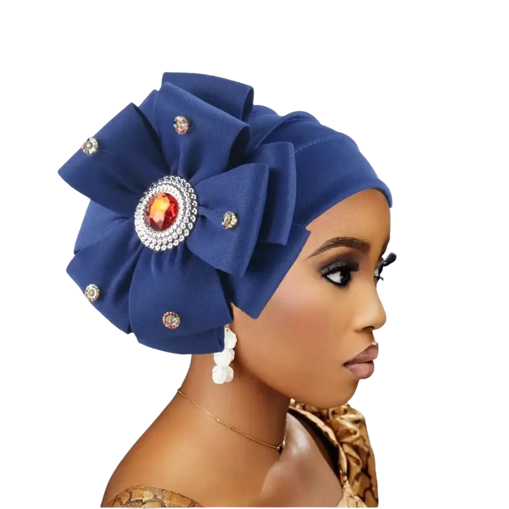 Diamond flower turban cap for women in deep blue satin with large floral embellishment and orange gemstone centerpiece