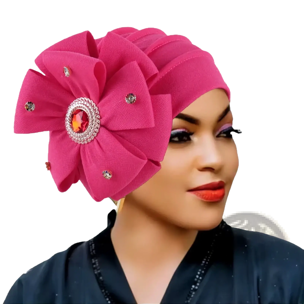 Vibrant fuchsia diamond flower turban cap for women with a large floral embellishment and orange gemstone centerpiece