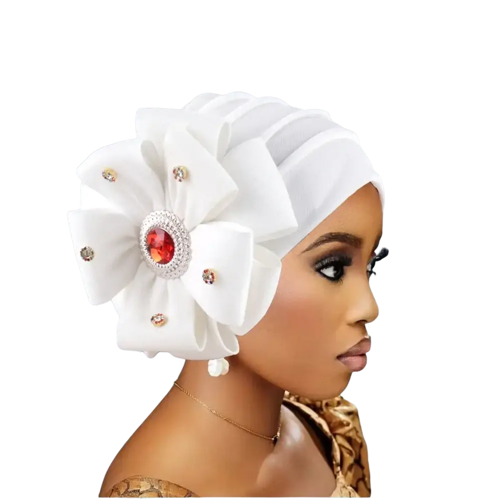 White fabric diamond flower turban cap for women with large layered floral embellishment and red gemstone center