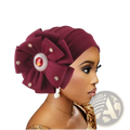 Maroon velvet diamond flower turban cap for women with large floral embellishment featuring orange gemstone and silver crystals