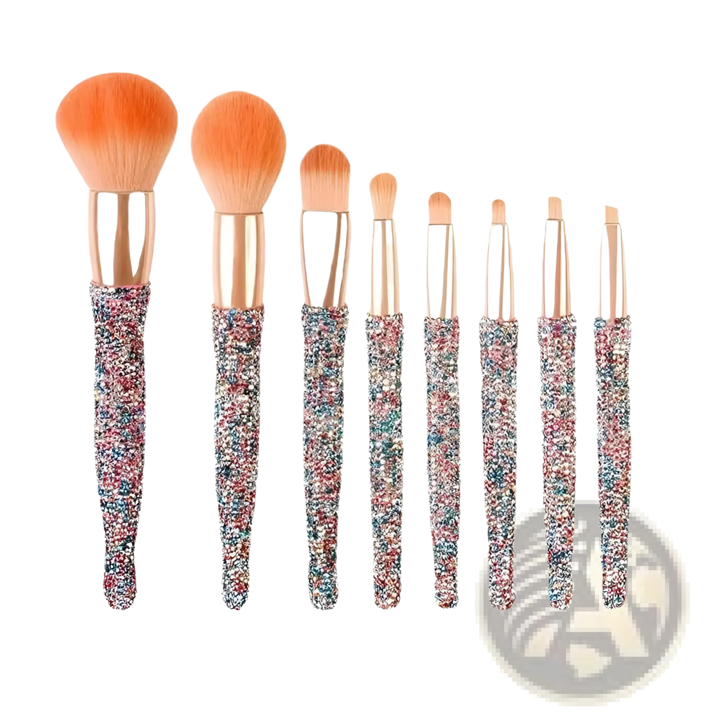 Set of seven glittery rose gold handled makeup brushes with multicolored sparkly handles and peach bristles
