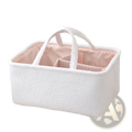 White textured fabric diaper caddy organizer with pink and white striped interior lining for nursery storage