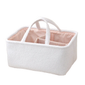 White textured fabric diaper caddy organizer with pink and white striped interior lining for nursery storage