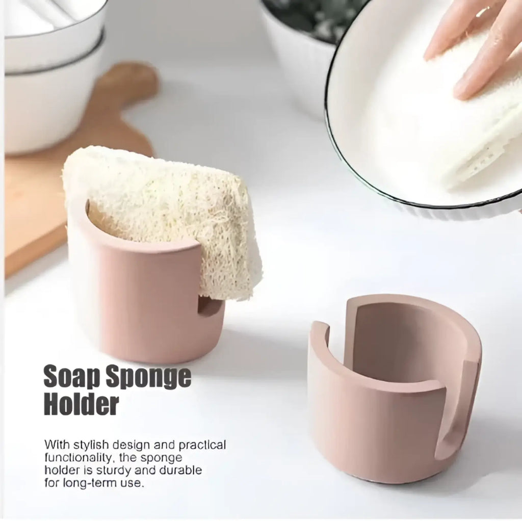 Pink ceramic diatom mud sponge rack with textured beige loofah in curved opening for sink caddy use