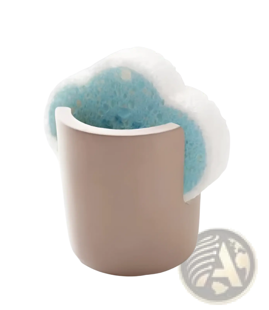A soft beige ceramic diatom mud sponge rack holds a fluffy white and light blue porous kitchen sponge